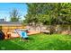 Backyard featuring a wooden deck, above ground pool, and lush green grass at 349 Clark Ave, Beech Grove, IN 46107