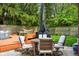 Backyard patio features an outdoor seating area with a table, chairs, and an umbrella at 349 Clark Ave, Beech Grove, IN 46107
