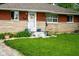 Charming brick home with a well-maintained lawn and landscaped front yard at 349 Clark Ave, Beech Grove, IN 46107
