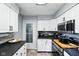 Well-organized kitchen featuring white cabinets, modern appliances, and a functional layout at 349 Clark Ave, Beech Grove, IN 46107
