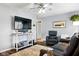 Comfortable living room featuring modern furniture, a large TV, and neutral decor at 349 Clark Ave, Beech Grove, IN 46107