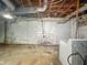 Unfinished basement with white walls, exposed pipes and ceiling at 3516 Janet Dr, Indianapolis, IN 46218