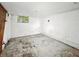Unfinished basement features concrete floor and white walls at 3516 Janet Dr, Indianapolis, IN 46218