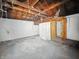Unfinished basement featuring walls and wood ceilings at 3516 Janet Dr, Indianapolis, IN 46218