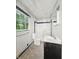 Bathroom features a window, toilet, shower, bathtub and sink at 3516 Janet Dr, Indianapolis, IN 46218
