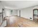 Bright living room showcasing hardwood floors and natural light from windows at 3516 Janet Dr, Indianapolis, IN 46218