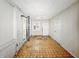 A spare room with paneled wall, tiled floors and exterior door at 3516 Janet Dr, Indianapolis, IN 46218