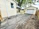 The backyard features a detached garage and asphalt driveway at 417 S Oakland Ave, Indianapolis, IN 46201