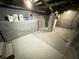 Spacious basement with painted walls, concrete floors, and utilities at 417 S Oakland Ave, Indianapolis, IN 46201