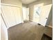 Comfortable bedroom featuring neutral walls, carpeting, and a spacious closet at 417 S Oakland Ave, Indianapolis, IN 46201