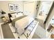 Serene bedroom with a cozy bed, stylish rug, and thoughtfully curated decor at 417 S Oakland Ave, Indianapolis, IN 46201