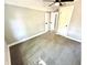 This bedroom features neutral walls, carpet, a ceiling fan, and traditional doors at 417 S Oakland Ave, Indianapolis, IN 46201