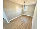 Dining area showcasing a modern lighting fixture and hardwood floors at 417 S Oakland Ave, Indianapolis, IN 46201