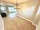 Dining room featuring hardwood floors and access to the kitchen at 417 S Oakland Ave, Indianapolis, IN 46201
