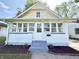 Image of home's front porch, a quaint entrance with new landscaping and fresh exterior paint at 417 S Oakland Ave, Indianapolis, IN 46201