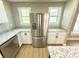 Bright kitchen featuring stainless steel appliances, white cabinets and granite countertops at 417 S Oakland Ave, Indianapolis, IN 46201