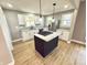 Bright kitchen area featuring granite countertops, white cabinets, and stainless steel appliances at 417 S Oakland Ave, Indianapolis, IN 46201