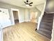 Inviting living room with hardwood floors, white trim, and stairway access at 417 S Oakland Ave, Indianapolis, IN 46201