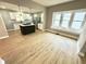 Inviting living room and kitchen area featuring modern fixtures and hardwood floors at 417 S Oakland Ave, Indianapolis, IN 46201