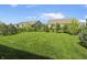 Well-manicured backyard with lush lawn and view of other houses at 4324 Homestead Dr, Whitestown, IN 46075