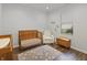 Bright Bedroom with a crib, chair, and window at 4324 Homestead Dr, Whitestown, IN 46075