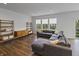 Comfortable living room featuring wood floors and natural lighting at 4324 Homestead Dr, Whitestown, IN 46075