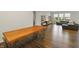 Bright living room features dark wood floors, a large sectional sofa and natural lighting at 4324 Homestead Dr, Whitestown, IN 46075
