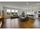 Living room area with large sectional sofa and bar height dining at 4324 Homestead Dr, Whitestown, IN 46075
