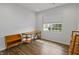 Sunlit room with shelving units, wood floors, and a large bright window at 4324 Homestead Dr, Whitestown, IN 46075