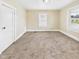 Comfortable bedroom features soft carpet and a bright window at 510 E 23Rd St, Anderson, IN 46016