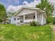 Charming home with a covered front porch and well-maintained lawn at 510 E 23Rd St, Anderson, IN 46016