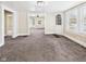 Spacious living room featuring plush carpet with easy access to other rooms at 510 E 23Rd St, Anderson, IN 46016