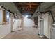 Unfinished basement with open ceiling, pipes, ductwork and concrete floor at 5648 Rolling Ridge Rd, Indianapolis, IN 46220