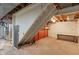 Unfinished basement with stairwell and utility access at 5648 Rolling Ridge Rd, Indianapolis, IN 46220