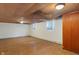 Unfinished basement area with paneled ceiling and walls at 5648 Rolling Ridge Rd, Indianapolis, IN 46220