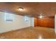 Unfinished basement area with paneled ceiling and walls at 5648 Rolling Ridge Rd, Indianapolis, IN 46220