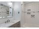 Bathroom with white subway tile, shower stall, and grey vanity with marble countertop at 5648 Rolling Ridge Rd, Indianapolis, IN 46220