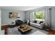 Stylishly decorated living room featuring a neutral color palette, comfortable seating, and ample natural light at 5648 Rolling Ridge Rd, Indianapolis, IN 46220