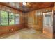 Office space with hardwood paneled walls and window overlooking backyard at 5648 Rolling Ridge Rd, Indianapolis, IN 46220