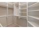 Large walk-in closet featuring an abundance of tiered shelving for optimal storage space at 5648 Rolling Ridge Rd, Indianapolis, IN 46220
