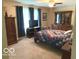 Inviting bedroom with cozy carpet, ceiling fan, and dresser, offering a relaxing and comfortable space at 569 Meadow Dr, Danville, IN 46122