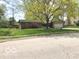 Charming ranch home featuring well-manicured lawn and mature shade trees, offering great curb appeal at 569 Meadow Dr, Danville, IN 46122