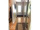 Inviting hallway with a mirror and natural light from the front door at 569 Meadow Dr, Danville, IN 46122