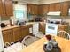 Functional kitchen with a window over the sink, and a breakfast table with chairs at 569 Meadow Dr, Danville, IN 46122