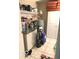 Laundry room featuring storage cabinets, a utility sink, and overhead shelves at 569 Meadow Dr, Danville, IN 46122