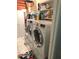 Functional laundry room equipped with a stacked washer and dryer, and shelving at 569 Meadow Dr, Danville, IN 46122