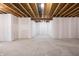 Spacious unfinished basement featuring concrete flooring and exposed wooden ceiling beams at 5770 Flagler Ln, Brownsburg, IN 46112