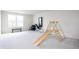 Spacious basement featuring a play area with climbing gym and weights at 5770 Flagler Ln, Brownsburg, IN 46112