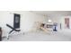 Spacious basement play area with a climbing gym, weight training equipment and storage shelves at 5770 Flagler Ln, Brownsburg, IN 46112