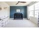 Bright Bedroom with a dark crib, blue accent wall, and white dresser at 5770 Flagler Ln, Brownsburg, IN 46112